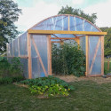 Serre tunnel en bois recouverte de bâche thermique incolore Plasticlair 200 microns – culture de légumes